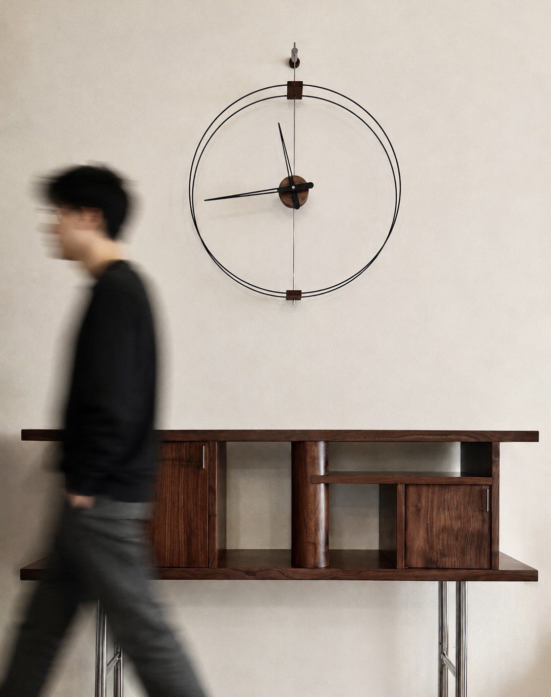 A person walking past the GLOAM Console